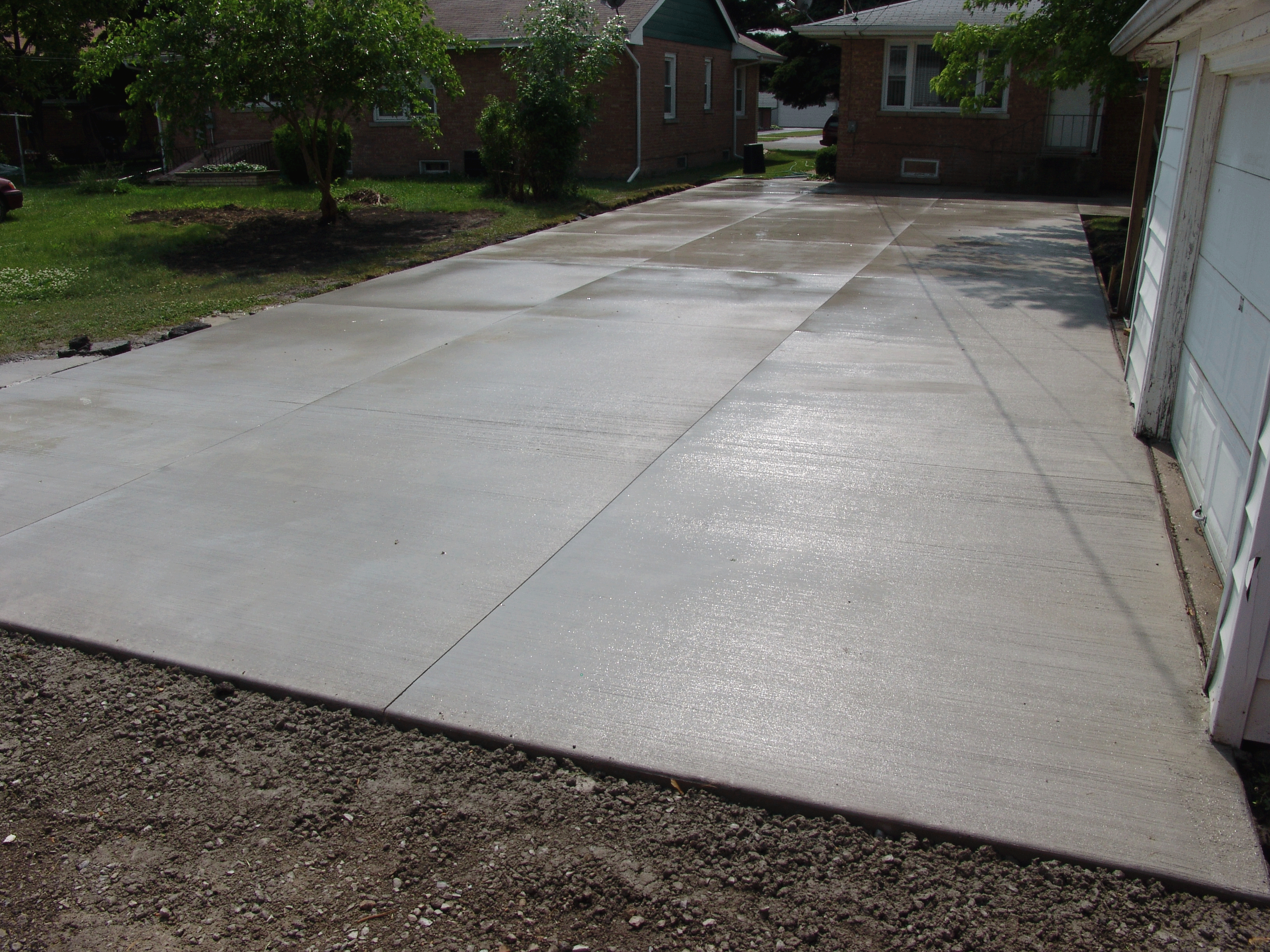 After picture of new concrete driveway.