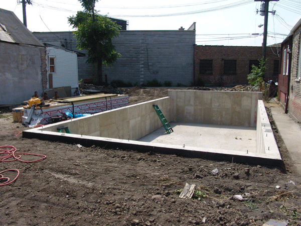 Completed foundation picture of above with new concrete basement floor in Chicago, IL. 