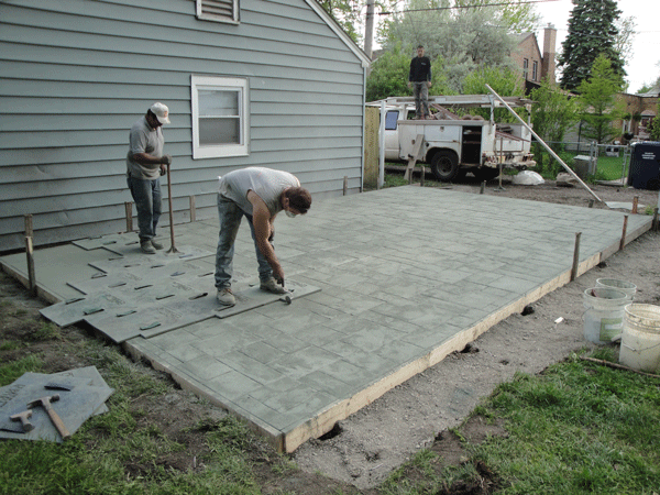 Concrete being stamped with Ashlar Slate pattern