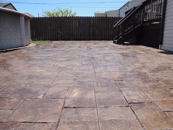 Stamped concrete patio in walnut color